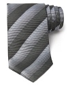 Thin tonal stripes dash across this handsome tie, rendered in luxurious Italian silk for classic opulence.