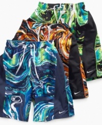 Catch the wave! He'll be ready to run full-force into the water with these comfy, drawstring swim trunks from Nike.