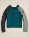 The raglan sleeves and the complimentary colorblock pattern adds warmth to this 80s-inspired pullover from ALTERNATIVE.