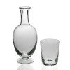 This elegant carafe and tumbler set from William Yeoward features a sophisticated spiral glass pattern. Makes a refined addition to your office or nightstand.