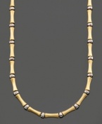 Simple style with a touch of the exotic. This bamboo necklace is crafted in 14k gold and sterling silver over sterling silver. Approximate length: 16 inches.