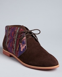 Classic chukka styling gets a dose of Western flair with tribal fabric accents in these DV Dolce Vita booties. They pack a lot of style into a low profile.