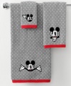 See you real soon! The ever-lovable Mickey Mouse steals the show in this hand towel from Disney, featuring a jacquard woven polka dot backdrop with an embroidered Mickey face. Finished with red trim.