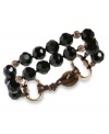 Black is twice as beautiful in this double-layer bracelet from Lucky Brand. Crafted from gold-tone mixed metal, the bracelet also features black glass stones for a classic look. Approximate length: 7-5/8 inches.