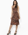 Smooth paisley jersey flatters the body in a feminine A-line silhouette with an elegant cross-wrap neckline.