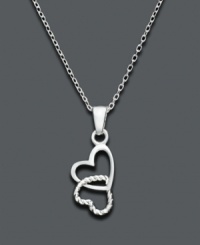 Hang on tight to the one you love. This delicate pendant features two hearts intertwined, one smooth and one textured. Unwritten necklace crafted in sterling silver. Approximate length: 18 inches. Approximate drop 1 inch.