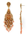 An ornate cascade formed from beautiful 14-karat gold, Swarovski crystals, and coral beads, Miguel Ases' chandelier earrings are a captivating jewelry choice.