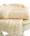 Beat the cold with this super-soft throw from Lauren Ralph Lauren. Features a boucle knit in a cream hue for a cozy addition anywhere in your home. Finished with a 3 fringe.