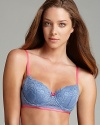 An allover lace bra with contrasting ribbon trim and bow at the center front. Style #E72-835