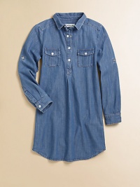 A go-with-anything wardrobe essential, the denim chambray shirt dress is classic and cool with signature embroidery in a snap-front design.Shirt collarLong sleeves with roll-tab snap cuffsSnap-frontFront snap-flap pocketsBack yokeShirttail hemCottonMachine washImported Please note: Number of snaps may vary depending on size ordered. 