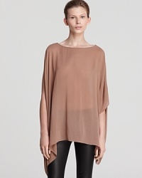 Easy elegance is manifested in this Helmut Lang top, designed with asymmetric details for a modern lift. Create a lofty effect and team the subtly sheer style with sleek opaque pants--the contrast is sublime.