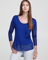 This slinky knit Vintage Havana top features a sheer asymmetric hem for a stylishly-illusive touch over denim.