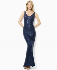 Exuding bold, elegant appeal, Lauren by Ralph Lauren's floor-length dress is tailored with a sequined mesh overlay and a sexy V-neckline at the front and back for a sleek, feminine look.