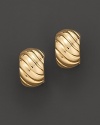 Yellow gold ribbed huggie earrings. With signature ruby accent. Designed by Roberto Coin.