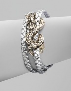 From the Naga Collection. A braid of rich leather wraps the wrist three times while weaving in and out of a curvaceous silver dragon.LeatherSterling silverLength, about 6½Lobster claspMade in Bali