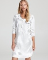 All-over polka dots lend a retro feel to this lace-accented, long-sleeve nightshirt from Eileen West.