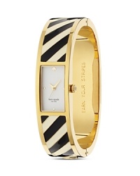 Just the ticket. This kate spade new york bangle watch takes its cues from the jewel box, crafted of plated metal and styled to bring a dose of whimsical allure to your timekeeping.