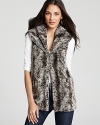 A wide shawl collar lends sumptuous warmth to this Alicia + Olivia faux fur vest, lush and relaxed for every day decadence.