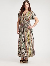 A spellbinding maxi dress featuring a vivacious print. The impeccably designed neckline will complement your decolletage as its Empire waist defines your shape.V-necklineShort sleevesEmpire waistAllover printConcealed back zipper About 43 from natural hem94% venezia/6% spandexDry cleanMade in USA