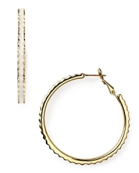 kate spade new york's ridged enamel and gold-plated hoops will make a bold addition to your jewel box. Slip them in to dress up denim or round out a cocktail look.