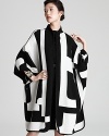 Be bold in this geometric knit Escada cape--the ultimate winter-wardrobe wow piece.