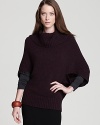 Enjoy a sumptuous silhouette as generous dolman sleeves and a decadent cowl neckline accent an effortless Eileen Fisher sweater.