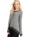 Cozy into Calvin Klein Jeans' nubby sweater - with a high-low hem and oversized fit, it's completely weekend-chic.