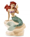 Splash! Ariel takes a break from the world under the sea in this lovely commemorative Disney figurine. Accented with 24-karat gold and measures 7.25.