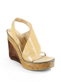 THE LOOKCurved patent leather top strapSide cutout detailOpen toeElastic slingback strapCork and wooded wedge, 5(125mm)Cork platform, 1¼(30mm)Compares to a 3¾ heel(95mm)THE MATERIALPatent leather upperLeather lining and soleORIGINMade in Italy