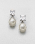 A simple and elegant design featuring a lustrous pearl accented with a brilliant crystal. 14mm round white organic man-made pearlCrystalsSterling silverSize, about 2Post clip backImported 