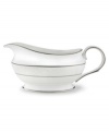 This elegant sauce boat is accented with a delicate flourish of vine-like, white-on-white imprints with raised, iridescent enamel dots. Holds 16 oz. 9 long. From Lenox's dinnerware and dishes collection.