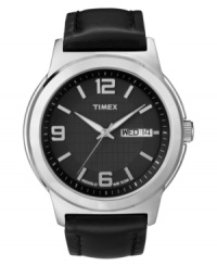 Timex updates a classic dress watch with the addition of contemporary details. Black leather strap and round silver tone mixed metal case. Black dial with inner grid-patterned dial features silver tone numerals at twelve, six and nine o'clock, stick indices, day and date window at three o'clock, luminous hands, and logo. Quartz movement. Water resistant to 30 meters. One-year limited warranty.