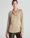 A subtle chain-link print lends luxe inspiration to a MICHAEL Michael Kors shirt for a glamorous 9-to-5 option.