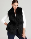 Lend a touch of opulence to your everyday style with a plush faux-fur DKNY vest, finished with a contrast knit back for a flawless fit.