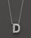 From the Tiny Treasures collection, a diamond D necklace. With signature ruby accent. Designed by Roberto Coin.