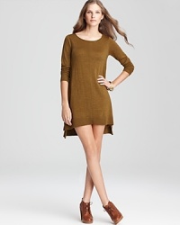 Enjoy a luxurious silhouette as sumptuous merino wool inspires an effortless Eileen Fisher sweater dress. The high/low hem lends itself to knit tights and chunky booties for rugged sophistication.