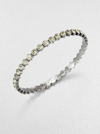 Lovely faceted glass stones with a radiant silvery tint are dotted along a slender bangle with a polished finish.GlassSilvertoneDiameter, about 2.5Imported