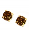 Go for sultry color with Anne Klein's stud earrings. Round-cut cubic zirconia in topaz hues complement your seasonal looks. Set in gold tone mixed metal. Approximate diameter: 1/3 inch.