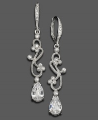 Crystal accents and rhodium-plated mixed metal weave together in an enticing swirl on these Eliot Danori earrings. Approximate drop: 1-1/4 inches.