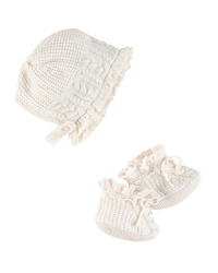 An adorable bonnet-and-bootie set is rendered in soft cable-knit cotton.