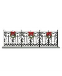 Arrange the Byers' Choice figurines in front of this faux wrought-iron fence. With traditional detail and pretty Christmas wreaths, it helps create a beautiful holiday scene.