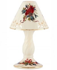 Ever so bright, the Winter Greetings candle lamp by Lenox combines everything that's beautiful about the season in pierced ivory porcelain with radiant gold trim.