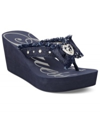 Frayed denim looks so cute on these wedges. GUESS' Sabaki platform wedge thong sandals feature a cute denim bow on the vamp with a rhinestone heart tag.