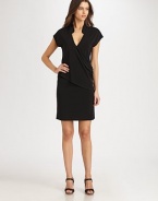 The LBD re-imagined, this jersey design features a classic mandarin collar leading to a seductive v-neckline and a fashion-forward draped, asymmetrical front. V-necklineShort sleevesDraped, asymmetrical bodice detailAbout 39 from shoulder to hem70% rayon/24% polyester/6% spandexDry cleanImported Model shown is 5'11½ (181cm) wearing US size Small. 