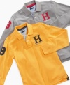 The polo shirt is in play: Tommy Hilfiger updates the classic with a capital H graphic, long sleeves, and a number patch, and winds up with a style that will carry any boy straight through the school year.