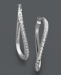 A simple twist and a lot of shine. These unique hoop earrings feature a twisted design accented by dozens of sparkling diamonds. Set in sterling silver. Approximate drop length: 1-1/2 inches. Approximate drop width: 1 inch.