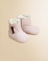 Precious baby booties crafted in ultra-plush suede with shearling lining and toggle button closure.Toggle closureLeather upperShearling leather liningLeather solePadded insoleImported