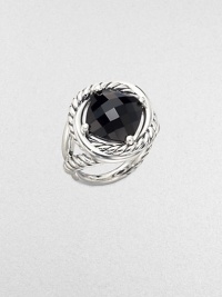 From the Infinity Collection. A deep, dramatic faceted stone of black onyx in a setting formed of intertwining smooth bands and cables of sterling silver.Black onyxSterling silverDiameter, about ½Imported