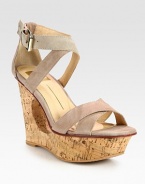 Stacked cutout wedge adds an architectural aesthetic to suede criss-cross straps with an adjustable ankle strap. Stacked cutout wedge, 4 (100mm)Stacked platform, 1 (25mm)Compares to a 3 heel (75mm)Suede upperLeather lining and solePadded insoleImported