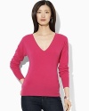 Warmth and style come together in harmony in a luxuriously soft V-neck rendered in cozy cashmere.